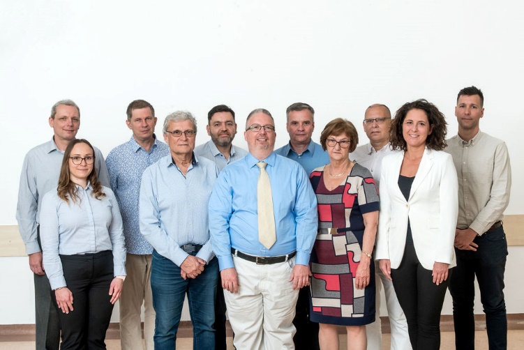 Group portrait of the GenuForm AI project team.
