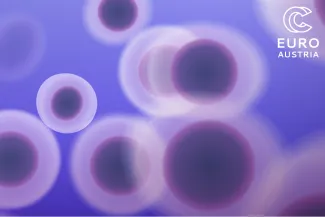 Purple cell‑like graphic with blurred circles 