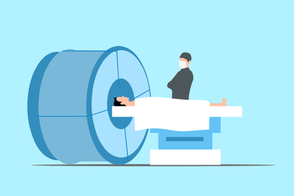 Patient in front of an MRI, next to it the doctor